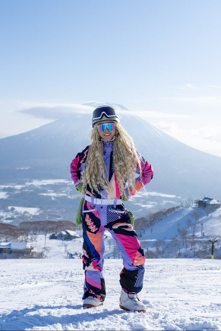 Person in colorful ski outfit with Mount Fuji in the background